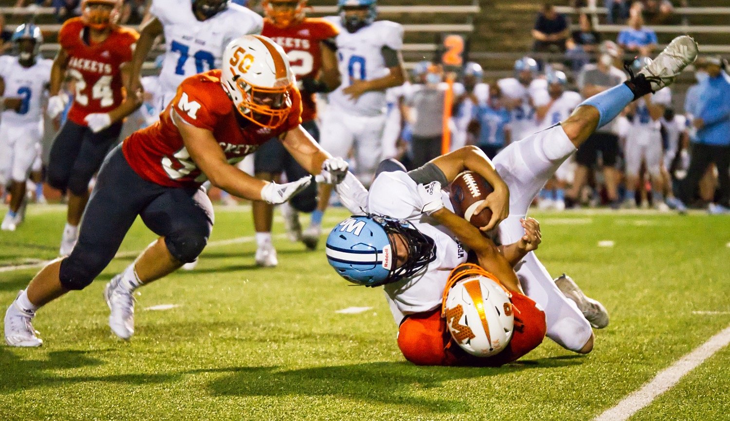 Drew Robertson comes up with a backfield tackle for the Mineola defense Friday.
